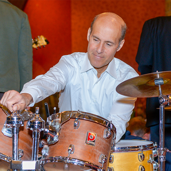 Adult male playing the drums