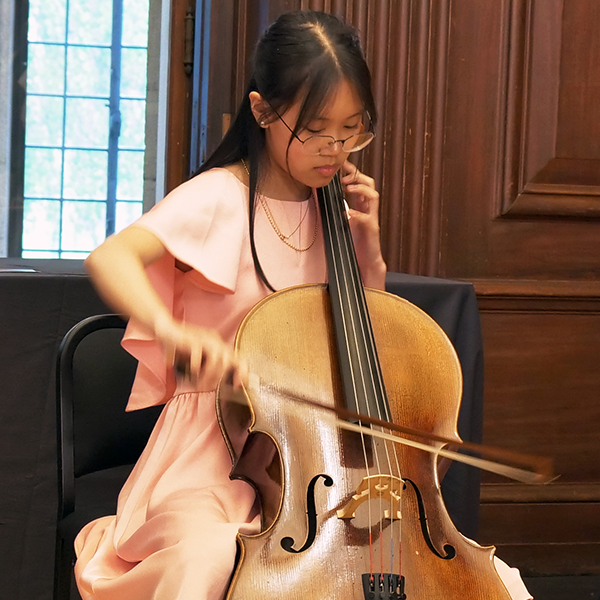 Young girl playing the cello