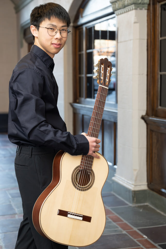 Boy holding a guitar