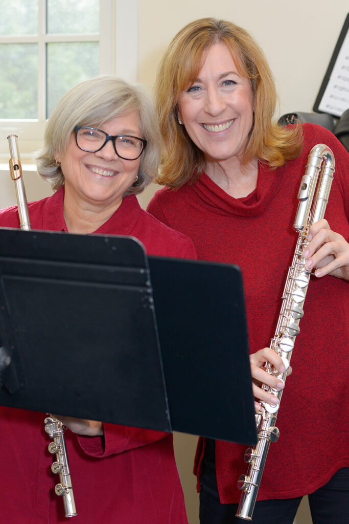 two women holding flutes