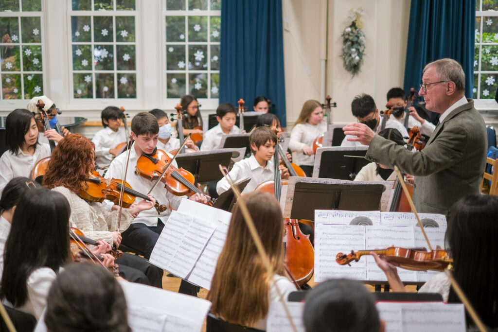 Student Orchestra with Male Conductor