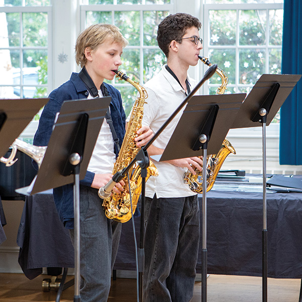 Teen boys playing saxophones