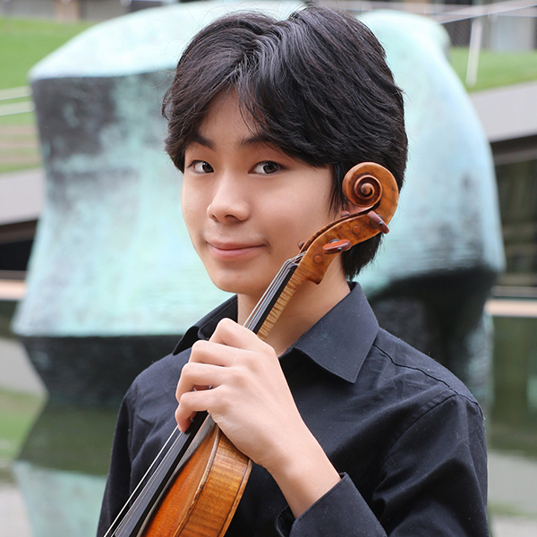 Teenage boy holding a violin