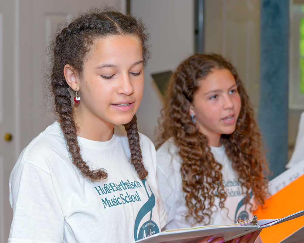 Young teen girls singing