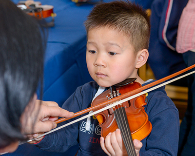 Suzuki student playing the violin