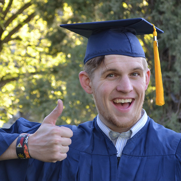 Graduating Senior giving thumbs up