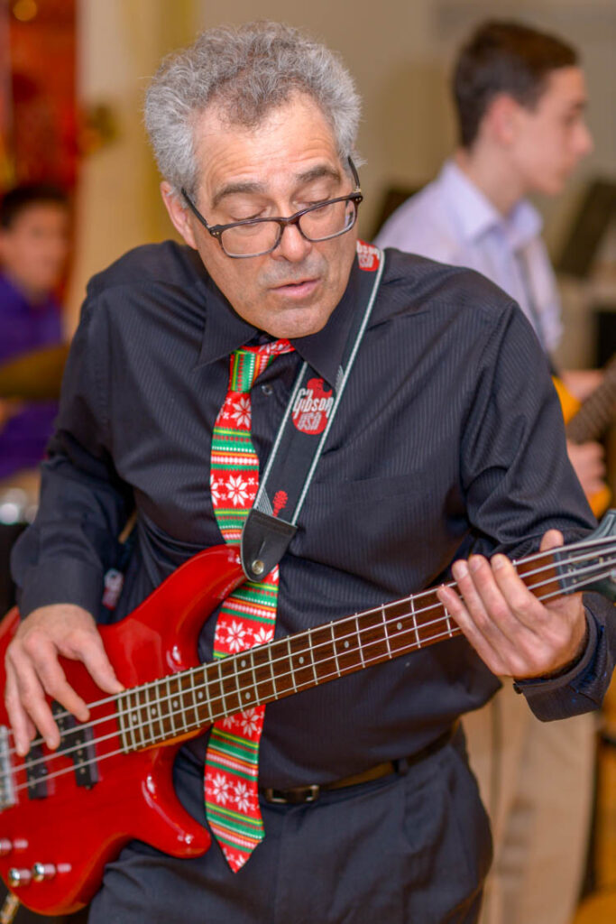 Ed Palermo playing the guitar